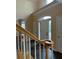 A two-story foyer with hardwood stairs, tile floors, and natural lighting at 3381 Walkers Ridge Rd, Dacula, GA 30019