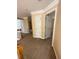 Second-floor hallway with neutral carpeting and white doors at 3381 Walkers Ridge Rd, Dacula, GA 30019