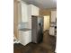 Kitchen featuring stainless steel refrigerator, white cabinets and tiled floors at 3381 Walkers Ridge Rd, Dacula, GA 30019