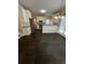 An open concept kitchen with white cabinets, stainless steel appliances, and tiled floors at 3381 Walkers Ridge Rd, Dacula, GA 30019
