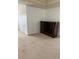 Living room with tan carpet, white walls and dark entertainment center at 3381 Walkers Ridge Rd, Dacula, GA 30019