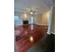 Bright living room with fireplace, ceiling fan, and gleaming hardwood floors at 3381 Walkers Ridge Rd, Dacula, GA 30019