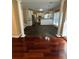 Open concept living space featuring tiled and hardwood floors, and white cabinets at 3381 Walkers Ridge Rd, Dacula, GA 30019