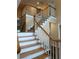 An interior shot of an attractive staircase with white risers and wooden treads and handrail at 3381 Walkers Ridge Rd, Dacula, GA 30019