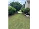 Landscaped yard with mature trees provides a serene outdoor space at 3381 Walkers Ridge Rd, Dacula, GA 30019