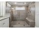 Spacious bathroom features a tile shower with seating and multiple shower heads at 4012 Townsend Ln, Dunwoody, GA 30346