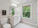 Bathroom boasts a window, large vanity, and tile floors at 4012 Townsend Ln, Dunwoody, GA 30346