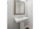 Pedestal sink with framed mirror in the bathroom at 4012 Townsend Ln, Dunwoody, GA 30346