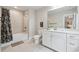 This bathroom includes a shower/tub combo, vanity and tile flooring at 4012 Townsend Ln, Dunwoody, GA 30346