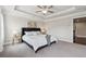 Bright bedroom with soft carpet, ceiling fan and space for your bedside tables at 4012 Townsend Ln, Dunwoody, GA 30346