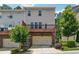 Exterior view of the home with back deck and two car garage at 4012 Townsend Ln, Dunwoody, GA 30346
