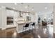 Bright kitchen features stainless steel appliances, white cabinets, hardwood floors and granite countertops at 4012 Townsend Ln, Dunwoody, GA 30346