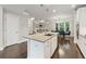 Kitchen island with granite countertops and a sink, perfect for food preparation, next to the dining area at 4012 Townsend Ln, Dunwoody, GA 30346