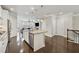 Bright open-concept featuring stainless steel appliances, granite countertops, and hardwood floors throughout at 4012 Townsend Ln, Dunwoody, GA 30346