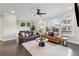 Bright living room features hardwood floors, large windows, and stylish furniture at 4012 Townsend Ln, Dunwoody, GA 30346