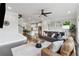 Open-concept living room with hardwood floors, fireplace, and open to the staircase and kitchen at 4012 Townsend Ln, Dunwoody, GA 30346