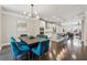 Open-concept living space with a modern kitchen island, dining area, and comfortable seating, perfect for entertaining at 4012 Townsend Ln, Dunwoody, GA 30346