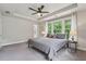 This bedroom includes carpet, ceiling fan, tray ceilings and natural light at 4012 Townsend Ln, Dunwoody, GA 30346