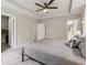 The spacious bedroom features plush carpet, a ceiling fan and tray ceiling at 4012 Townsend Ln, Dunwoody, GA 30346