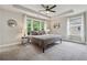The bedroom offers natural light, tray ceilings, carpet, and a ceiling fan at 4012 Townsend Ln, Dunwoody, GA 30346