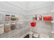 Walk-in pantry with metal shelving, providing ample storage for all your food and household needs at 4012 Townsend Ln, Dunwoody, GA 30346