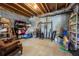 Unfinished basement space with concrete floor, storage items, and exposed ductwork, offering potential for customization at 5963 Wild River Vw, Sugar Hill, GA 30518
