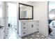 Bathroom vanity area featuring a tile floor, and a mirror that offers views of another bathroom at 5963 Wild River Vw, Sugar Hill, GA 30518