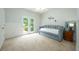 Cozy bedroom with a daybed, neutral carpeting, and access to the backyard at 5963 Wild River Vw, Sugar Hill, GA 30518