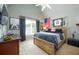 Spacious bedroom decorated with baseball memorabilia, offering a cozy and inviting space at 5963 Wild River Vw, Sugar Hill, GA 30518