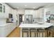 Bright kitchen with white cabinets, stainless steel appliances, and a large island with seating at 5963 Wild River Vw, Sugar Hill, GA 30518