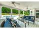 A porch with a ceiling fan overlooking the swimming pool at 5963 Wild River Vw, Sugar Hill, GA 30518