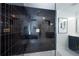 Modern black tile shower with glass door at 5963 Wild River Vw, Sugar Hill, GA 30518