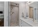Modern bathroom features a glass enclosed shower, sink with quartz countertop and nice lighting at 629 2Nd Avenue, Decatur, GA 30030