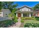 Inviting two-story home with a covered front porch, manicured lawn, and vibrant landscaping at 629 2Nd Avenue, Decatur, GA 30030