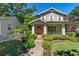 Charming two-story home with inviting front porch and walkway, surrounded by a well-manicured lawn at 629 2Nd Avenue, Decatur, GA 30030