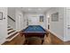 Entertaining game room with a pool table, hardwood floors and stylish decor at 629 2Nd Avenue, Decatur, GA 30030
