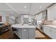 Open kitchen layout featuring a large island with seating, stainless steel appliances, and seamless flow to the living areas at 629 2Nd Avenue, Decatur, GA 30030
