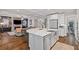 The gourmet kitchen has a large island, stainless appliances, and is open to living area with fireplace at 629 2Nd Avenue, Decatur, GA 30030
