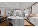 Gourmet kitchen featuring a large island, stainless steel appliances, and an open design to the living area at 629 2Nd Avenue, Decatur, GA 30030