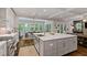 Open kitchen design with a large central island, white countertops and lots of cabinet space at 629 2Nd Avenue, Decatur, GA 30030