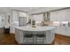 Modern kitchen with large marble island, stainless steel appliances, custom cabinets and hardwood floors at 629 2Nd Avenue, Decatur, GA 30030