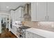 Bright kitchen features white cabinets, stainless steel appliances, and decorative backsplash at 629 2Nd Avenue, Decatur, GA 30030