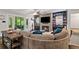 Inviting living room with a fireplace, built-in bookshelves, ceiling fan, and access to the screened porch at 629 2Nd Avenue, Decatur, GA 30030