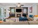 The comfortable living room features a fireplace, ceiling fan, built-in bookshelves, and access to outdoor living at 629 2Nd Avenue, Decatur, GA 30030
