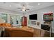 Stylish living room with hardwood floors, comfortable seating, and a pinball machine at 629 2Nd Avenue, Decatur, GA 30030