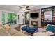 Inviting living room with a fireplace, built-in bookshelves, and a comfortable sectional sofa at 629 2Nd Avenue, Decatur, GA 30030