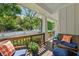 Relaxing covered porch featuring comfortable seating and a view of the landscaped yard at 629 2Nd Avenue, Decatur, GA 30030