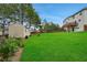 Large backyard features a shed and garden, perfect for outdoor activities and relaxation at 909 Shatley Dr, Stockbridge, GA 30281