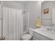 Neutral bathroom featuring a shower/tub combination with white curtain and vanity with sink at 909 Shatley Dr, Stockbridge, GA 30281