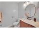 Elegant bathroom featuring custom wood cabinets, marble countertop, and designer fixtures at 909 Shatley Dr, Stockbridge, GA 30281